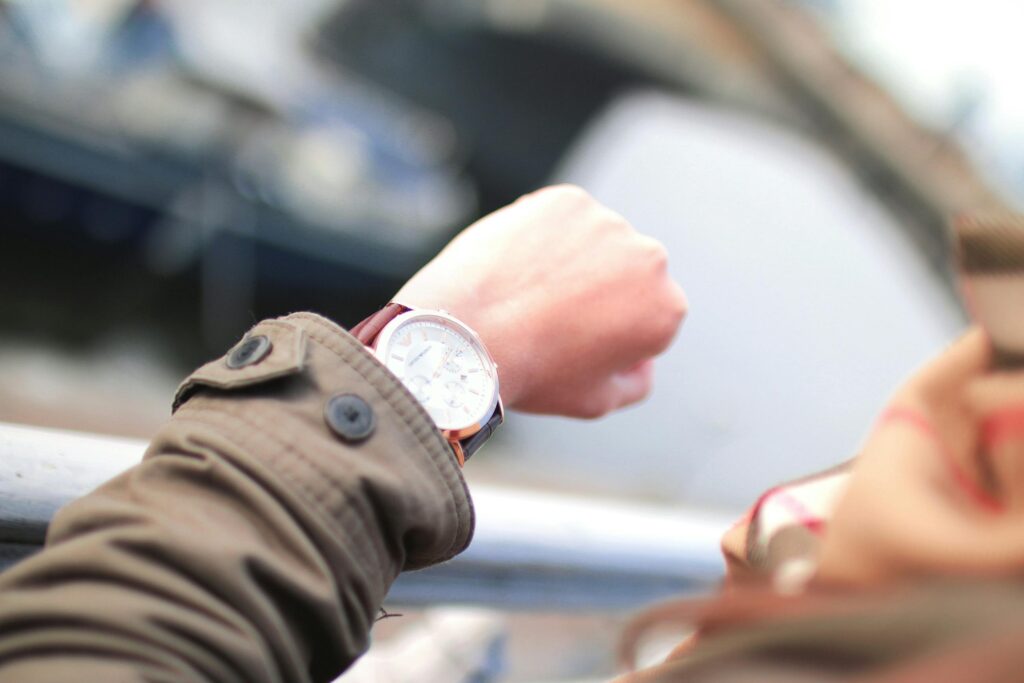 A person looks at a watch to signify talent development